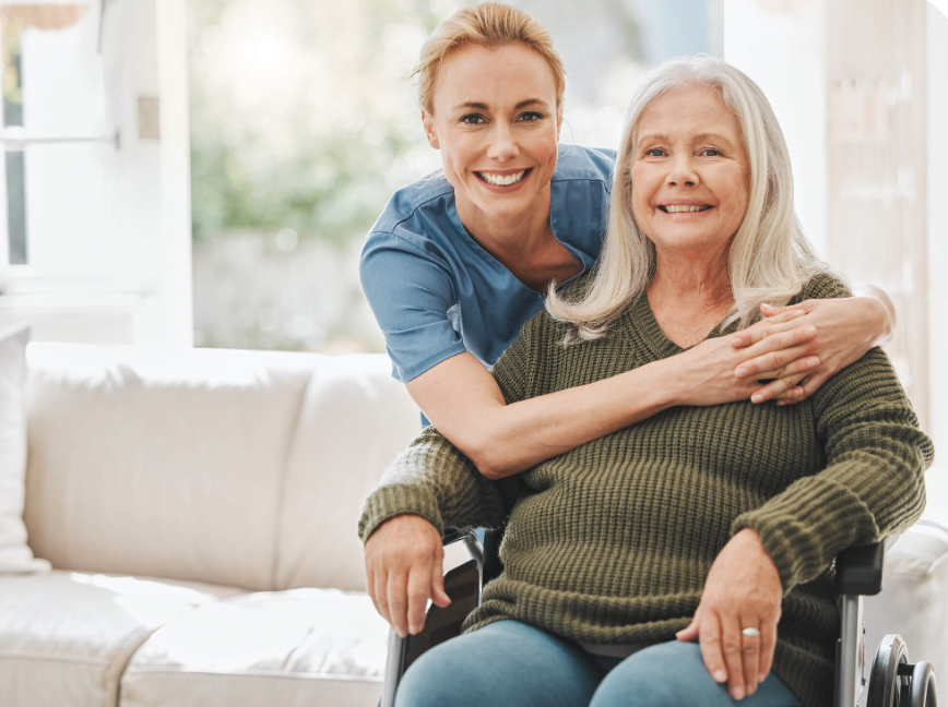 A caregiver and older client sharing a reassuring, personal home-care moment together